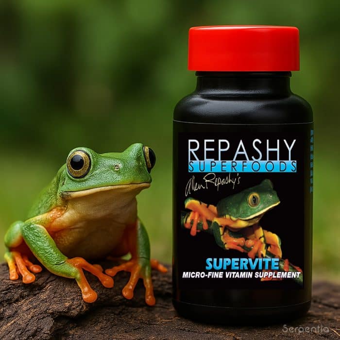 Repashy Supervite 85g shown beside a tree frog in a natural setting, reptile vitamin supplement lifestyle image.