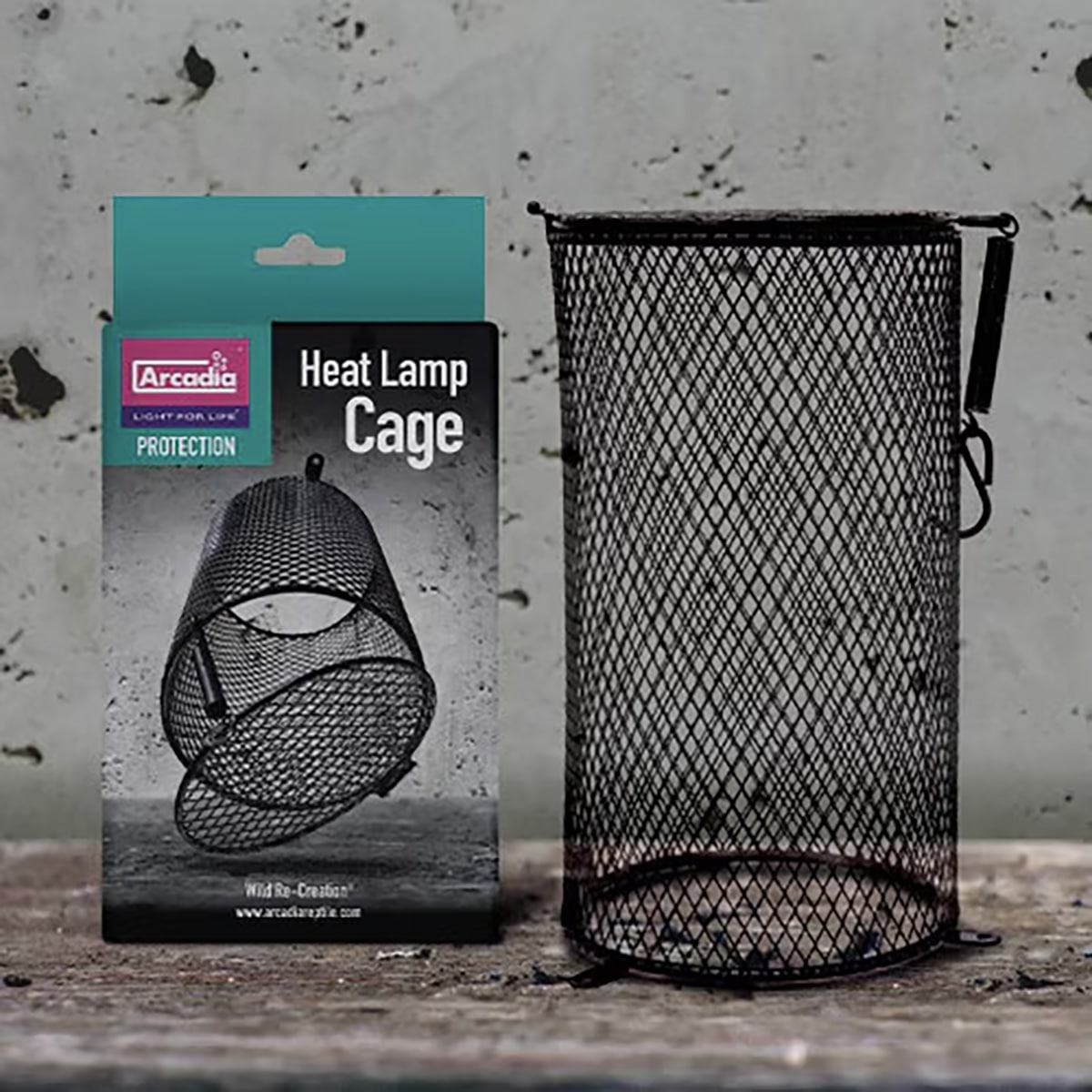 Arcadia Heat Lamp Cage next to retail packaging