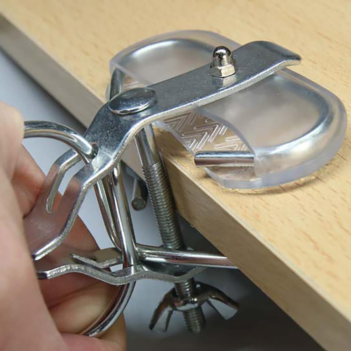 Arcadia clamp lamp securely fixed to enclosure edge using clamp system