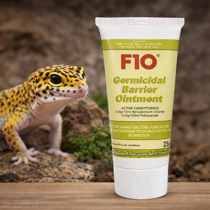 F10 Germicidal Barrier Ointment 25g shown with leopard gecko for reptile wound care and skin protection.