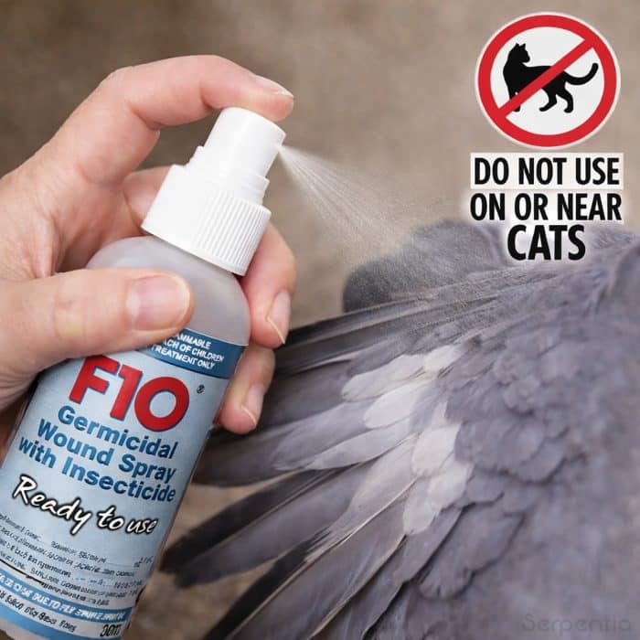 F10 germicidal wound spray with insecticide being applied to a bird, with warning not to use on or near cats.