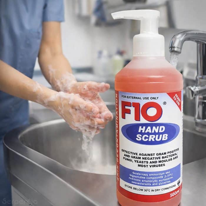F10 Hand Scrub 500ml being used for antimicrobial handwashing at a sink in a clinical environment