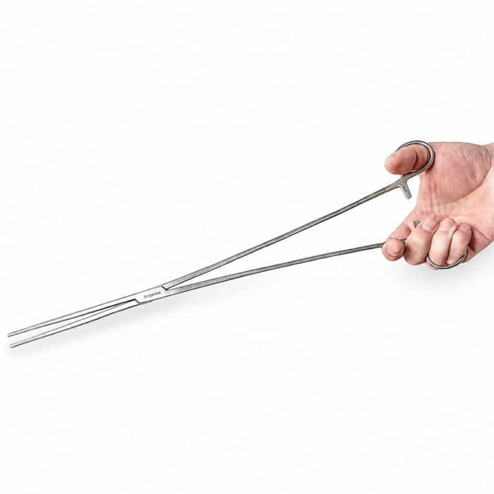 Serpentia 45cm Long Stainless Steel straight tip reptile feeding tongs showing being held for size comparison